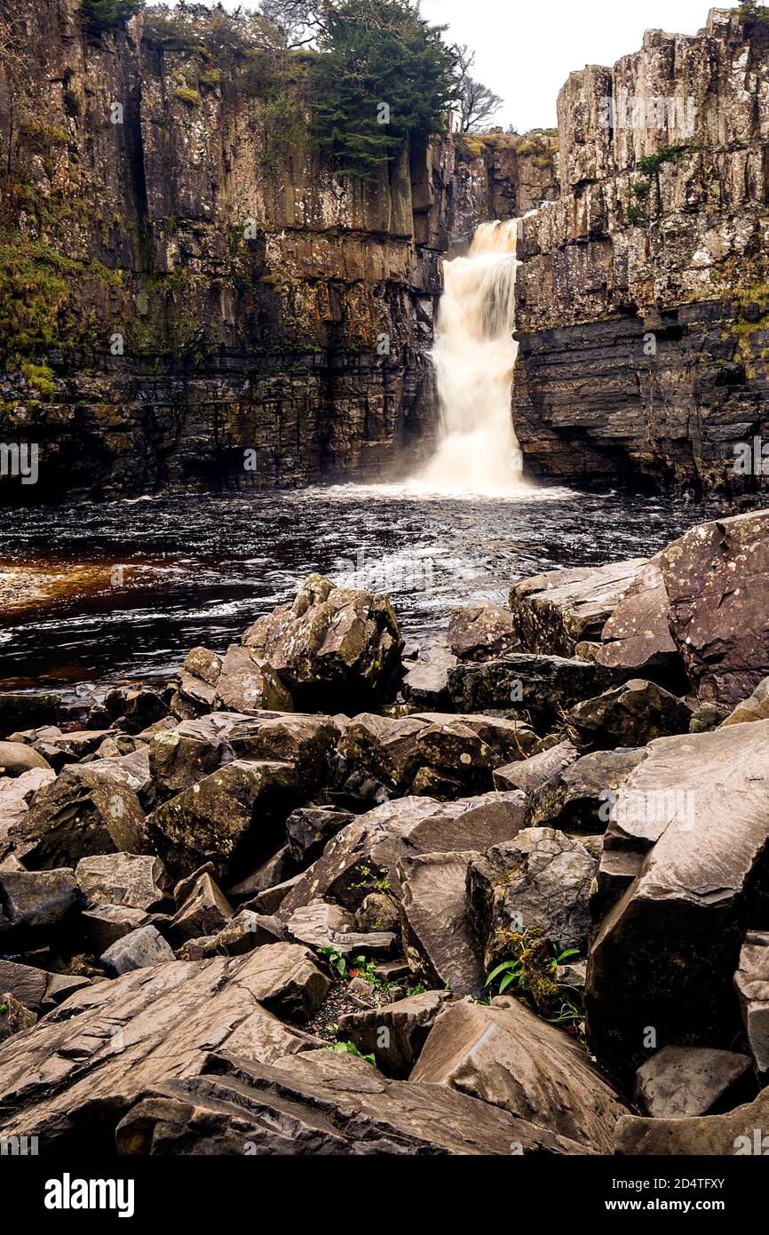 High Force Waterfall flowing through rocky landscape. Stock Photo