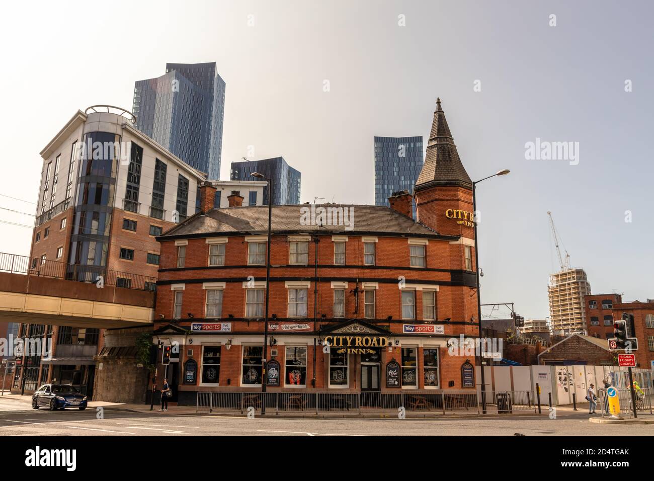 Historic building of The City Road Inn by Deansgate Locks an old survivor among tall modern buildings in the city centre. Stock Photo