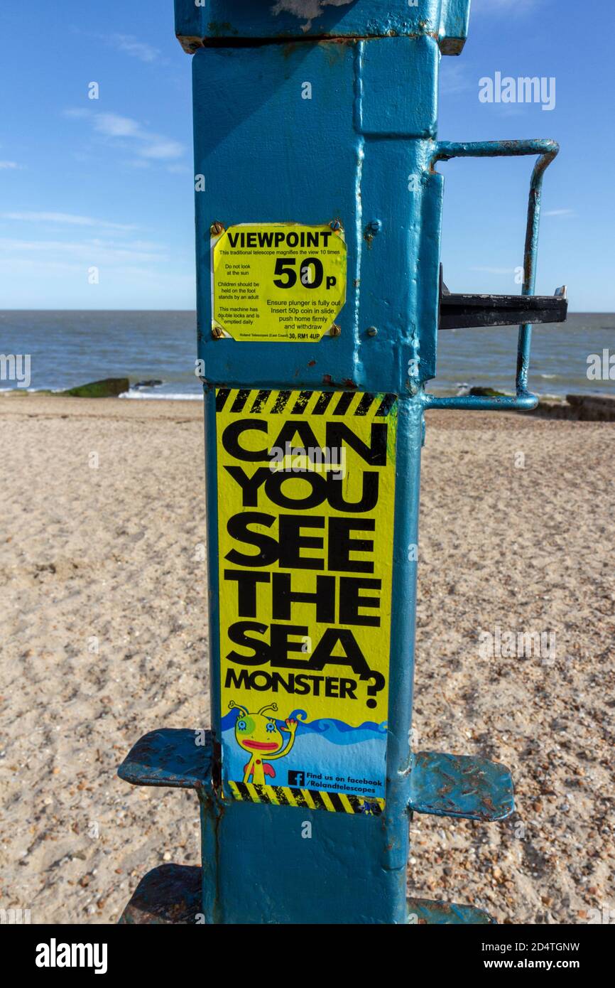 "Can You See the Sea Monster? on a beach side binoculars/telescope on