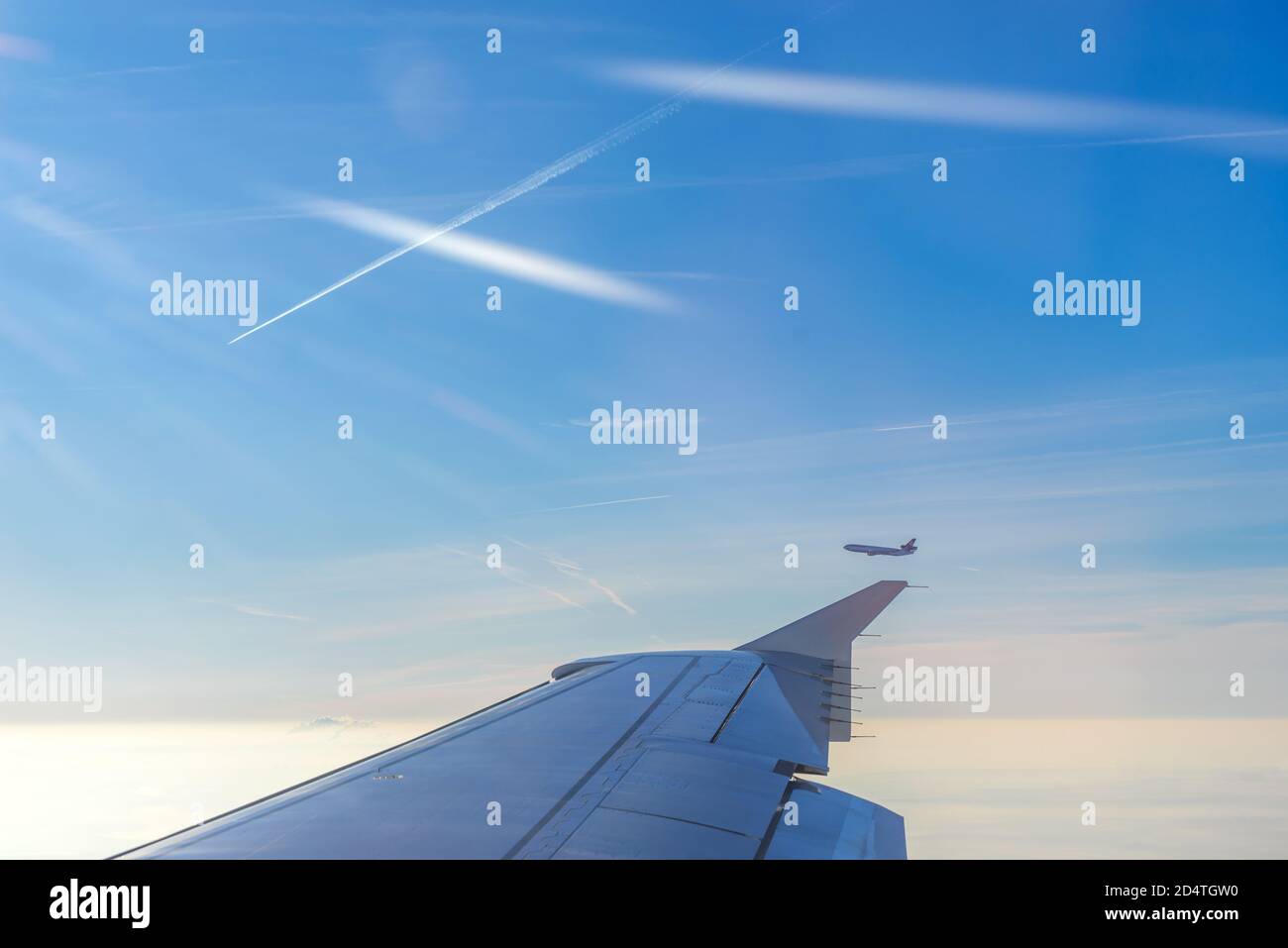 In Flight airplane wing above the clouds Stock Photo - Alamy