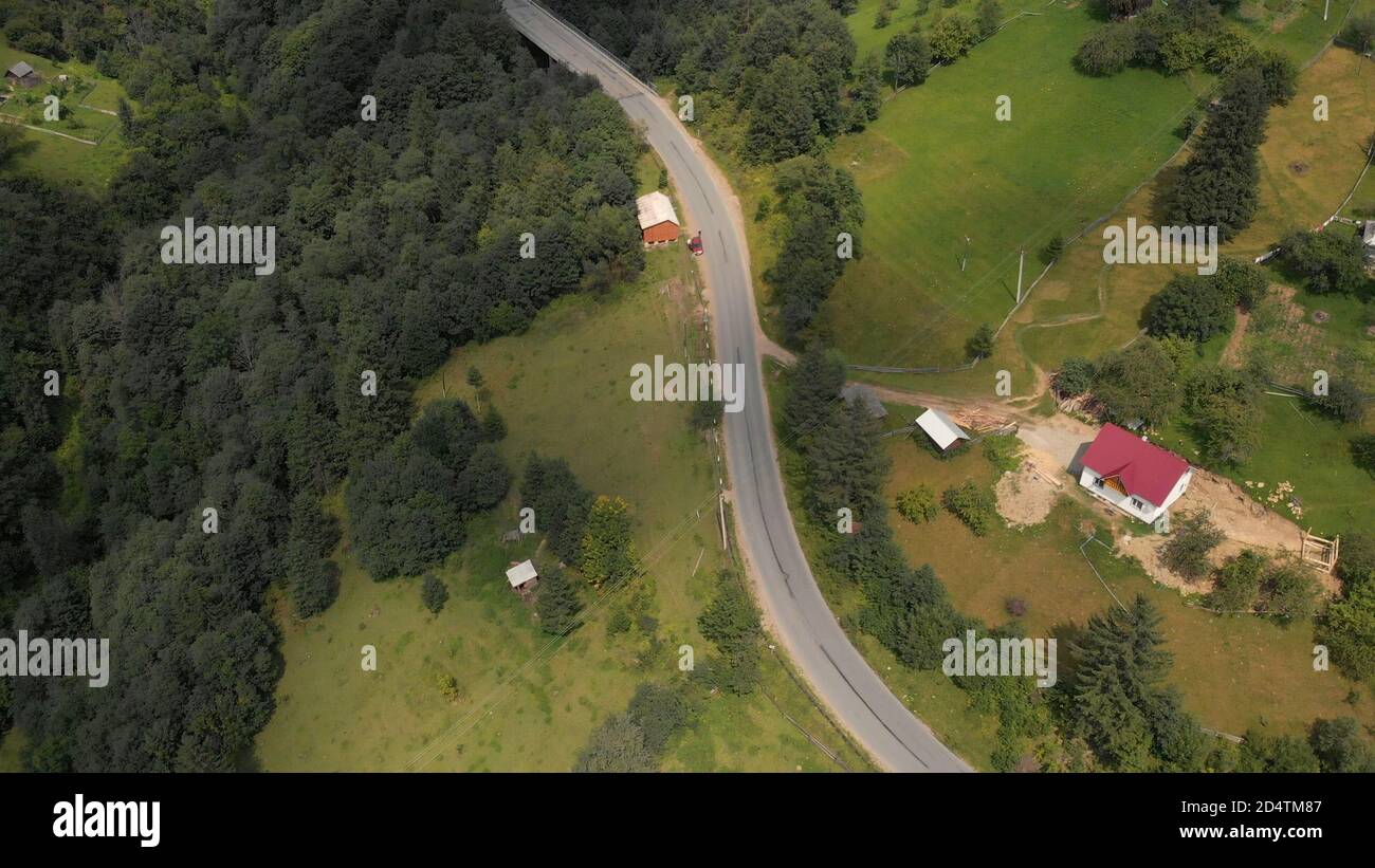 Aerial view road and house in a forest Stock Photo - Alamy