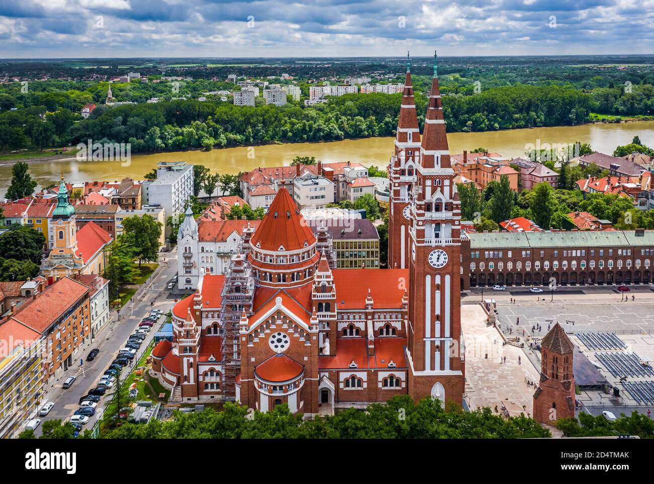 Szeged, Hungary - Aerial view of the Votive Church and Cathedral of Our Lady of Hungary (Szeged Dom) on a sunny summer day with River Tisza and blue s Stock Photo