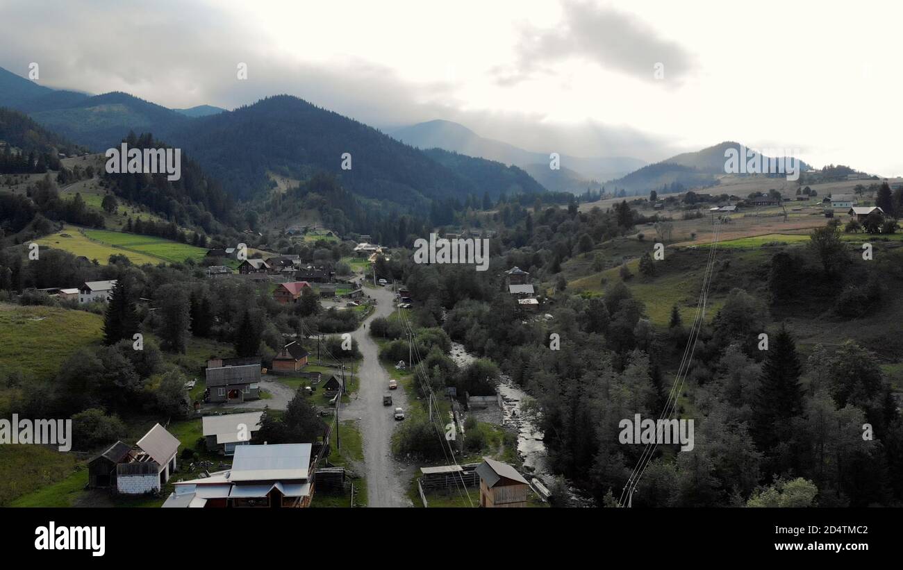 View from the top to the mountain village Stock Photo - Alamy