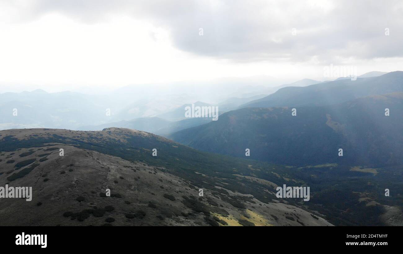 Silhouettes of misty mountains Stock Photo - Alamy