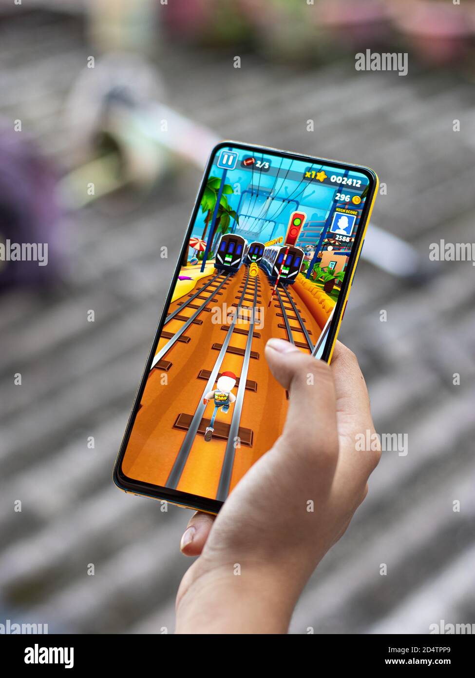 An iPhone mobile with the game Subway surfers Stock Photo - Alamy