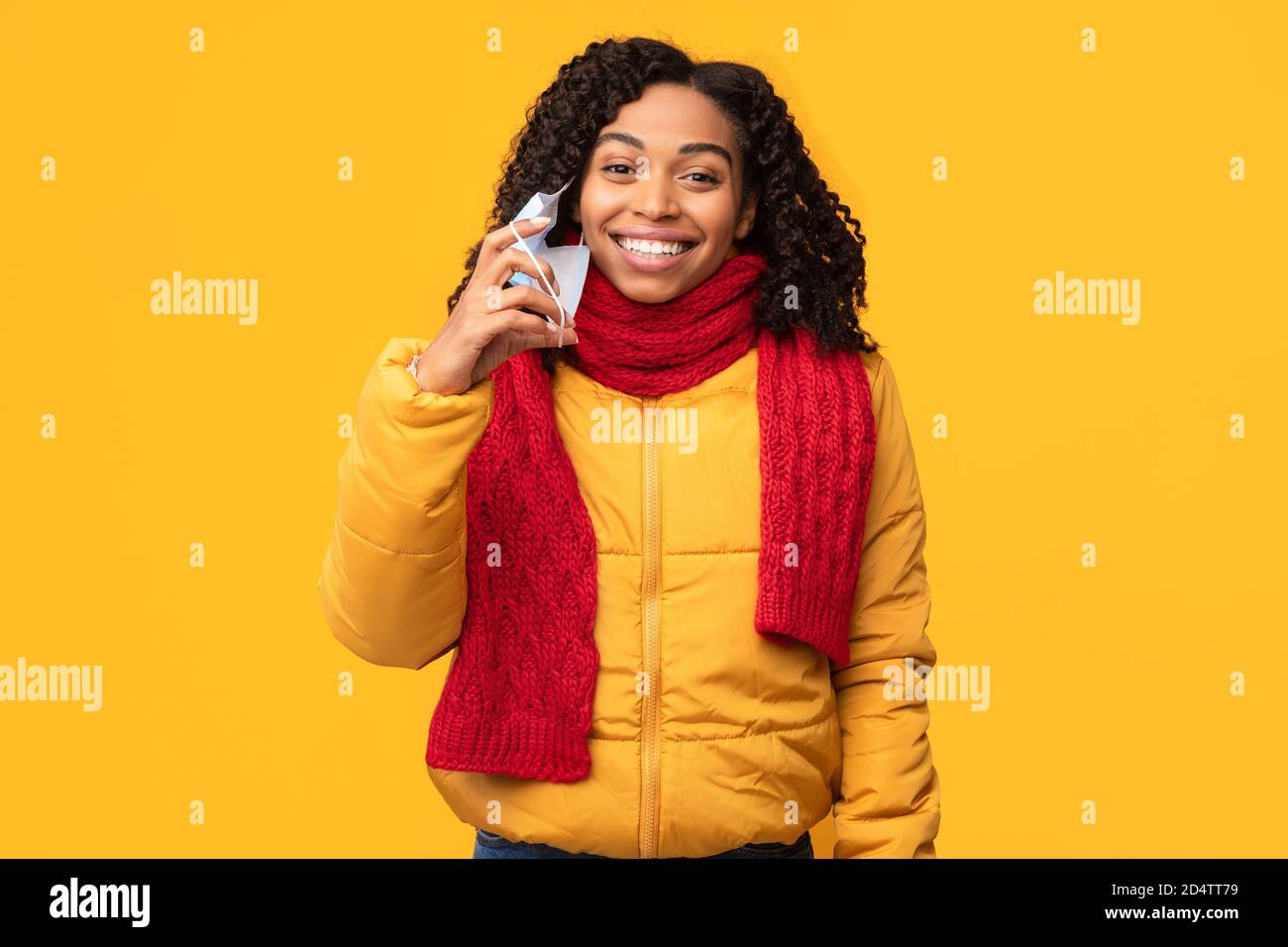 Young woman taking off black hi-res stock photography and images - Alamy