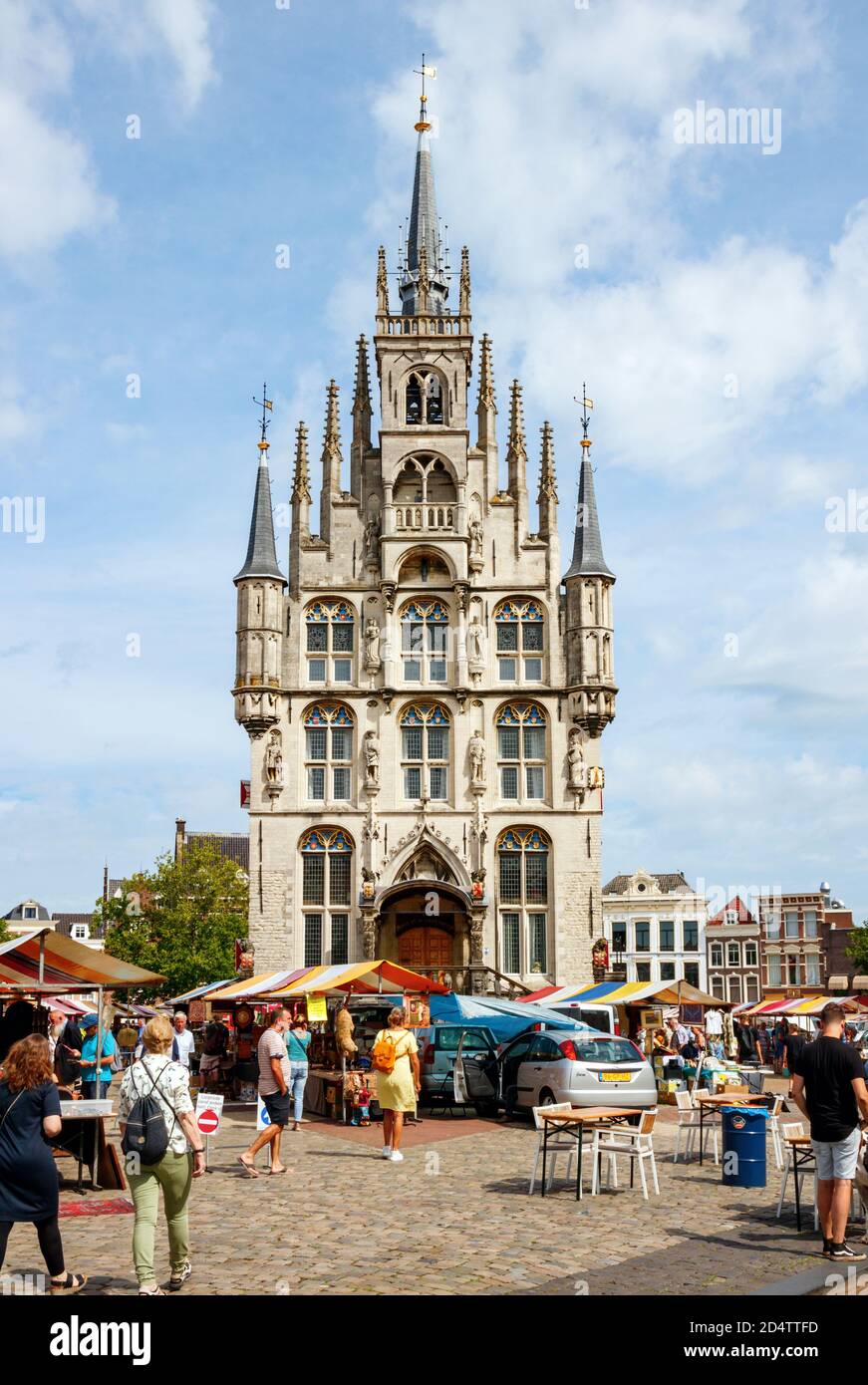 View of the Gouda historic city centre. Markt (Market) with the famous city hall, an example of gothic architecture, on a sunny afternoon. South Holla Stock Photo