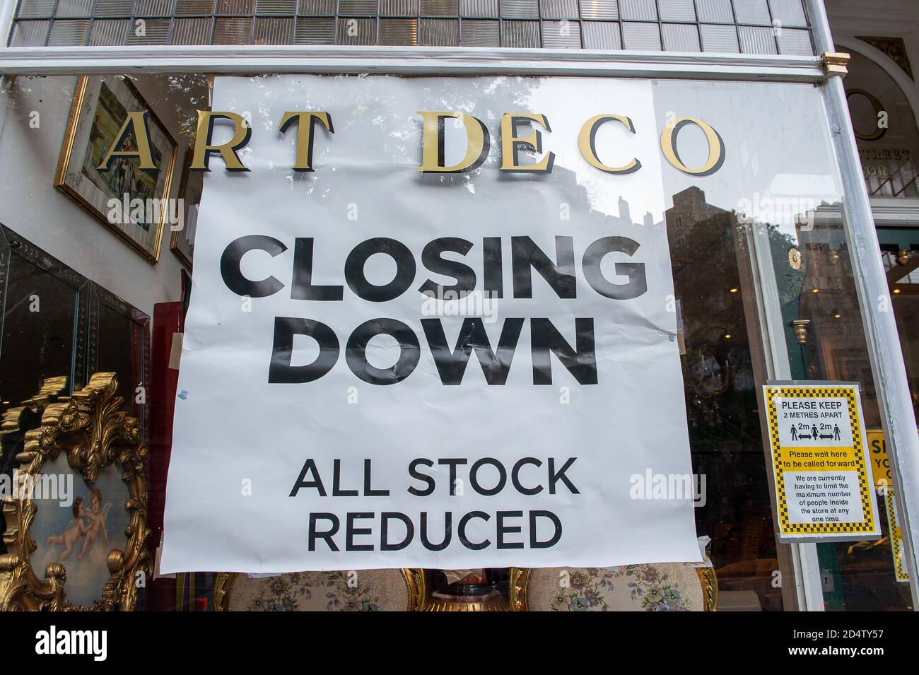 Windsor, Berkshire, UK. 11th October, 2020. A closing down sign at an Art Deco antiques shop. Twenty new cases of Covid-19 have been reported in the past 24 hours in the Royal Borough of Windsor and Maidenhead. Shops and restaurants have more notices in their windows about the measures they are taking to help stop the spread of Covid-19. The Government are expected to announce a new three tier system lockdown system for England following a second spike in positive cases. Credit: Maureen McLean/Alamy Stock Photo