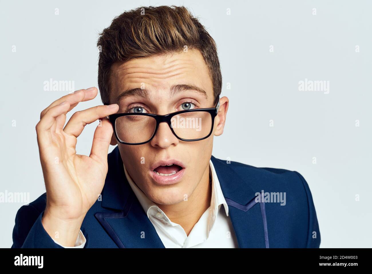 Business man wearing glasses blue suit cropped view official light ...
