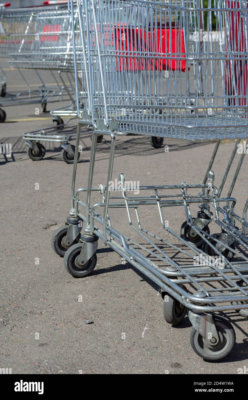 Supermarket Shopping HandCart Cart. Supermarket shopping trolleys in outdoor parking. Empty
