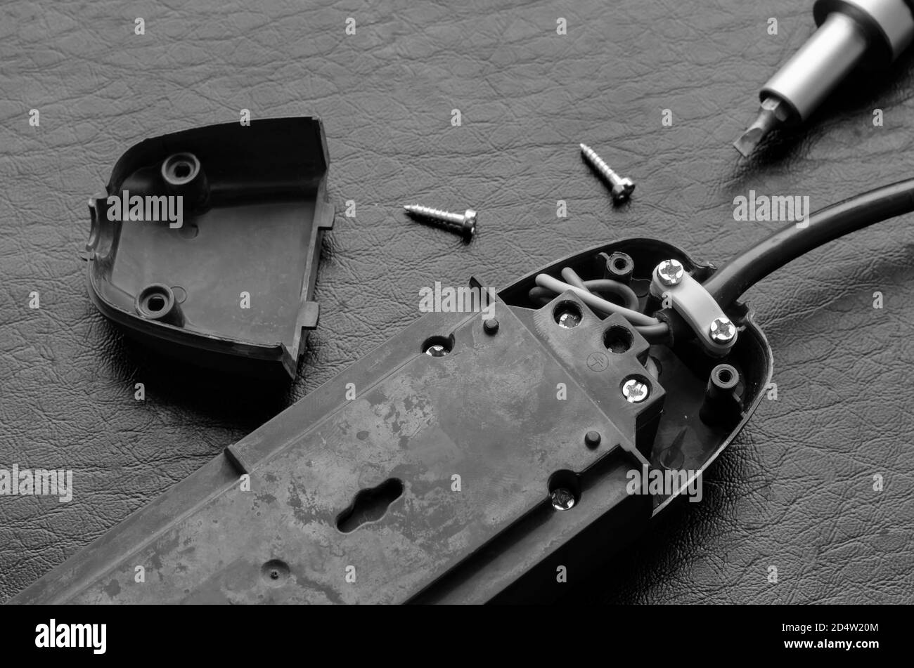 Disassembled Electrical Extension Cord On A Black Table Repair Of Electrical Devices Black And White Photo Without Anyone Stock Photo Alamy