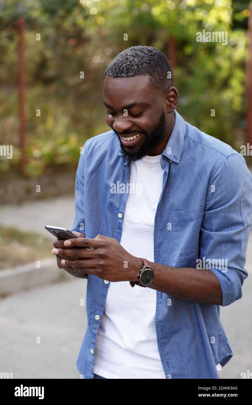 Man Using Mobile App Happy man using mobile phone apps, texting message, browsing internet ...