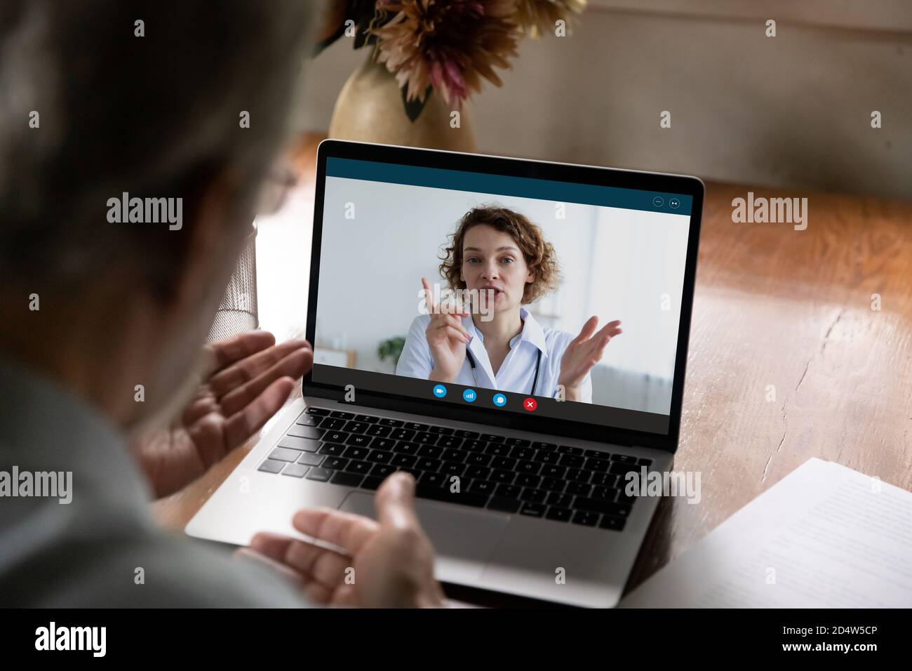 Elderly man talk consult online with doctor Stock Photo