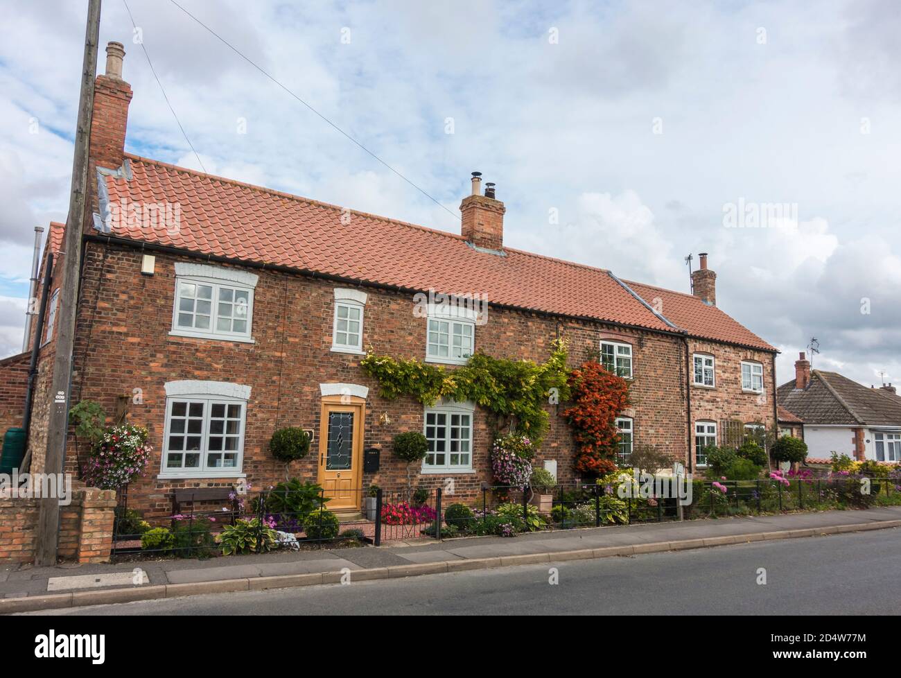 Old cottages with well tended gardens High Street Cherry Willingham
