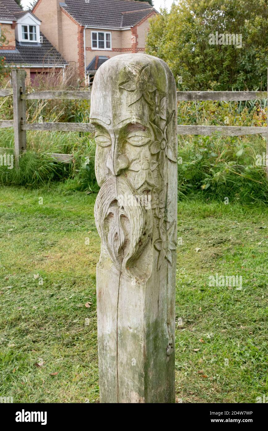 Wood post carved in likeness of Green Man Chery Willingham Lincolnshire October 2020 Stock Photo