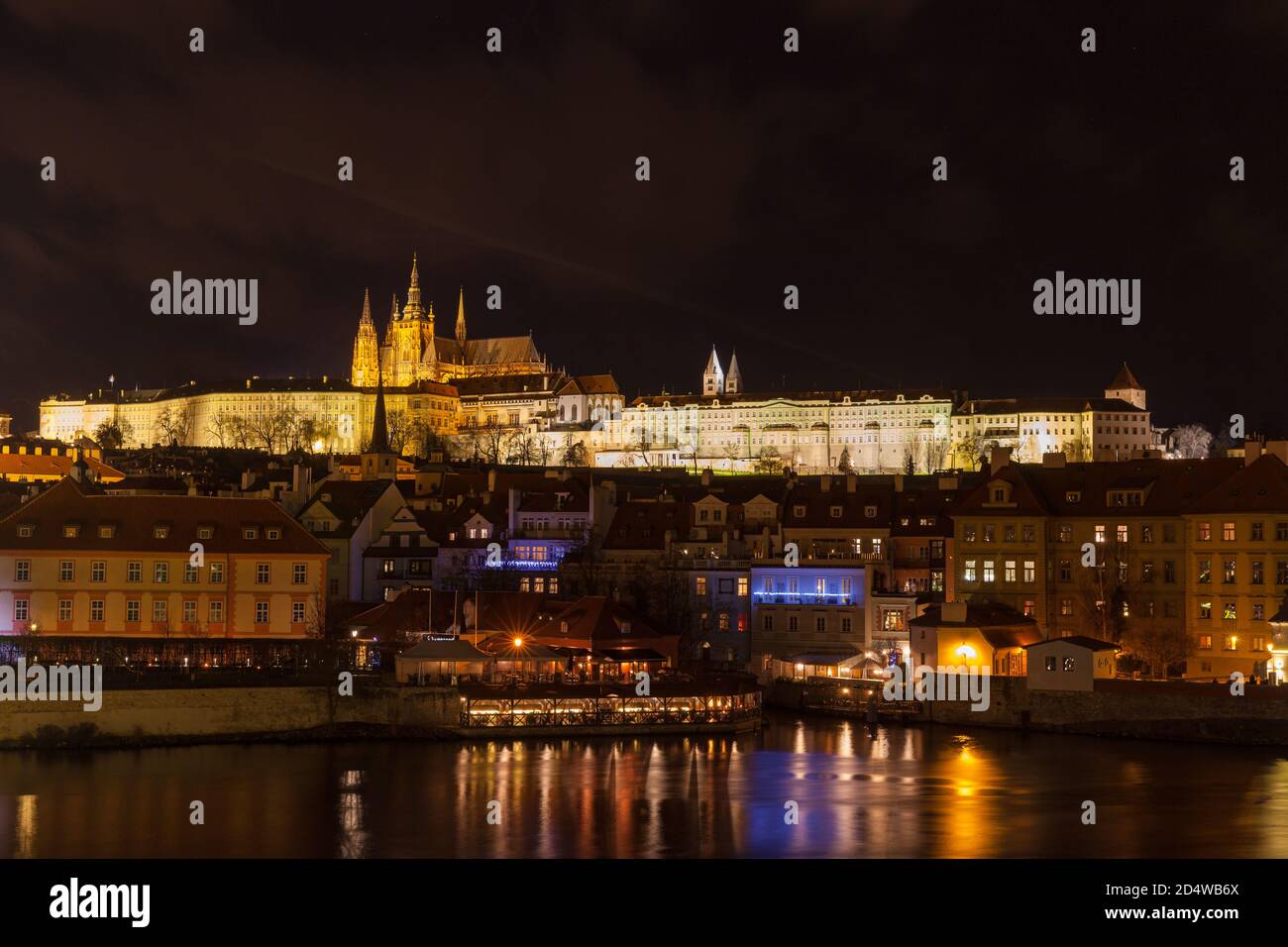 Beautiful night view of the light illuminated Prague Castle and St. Vitus Cathedral in Mala Strana old town by Vltava River from Charles Bridge, Pragu Stock Photo