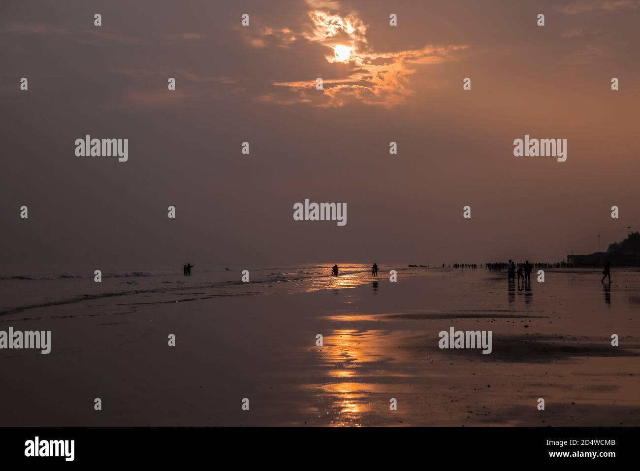 Beautiful sunset view reflecting sunlight on the beach Stock Photo - Alamy