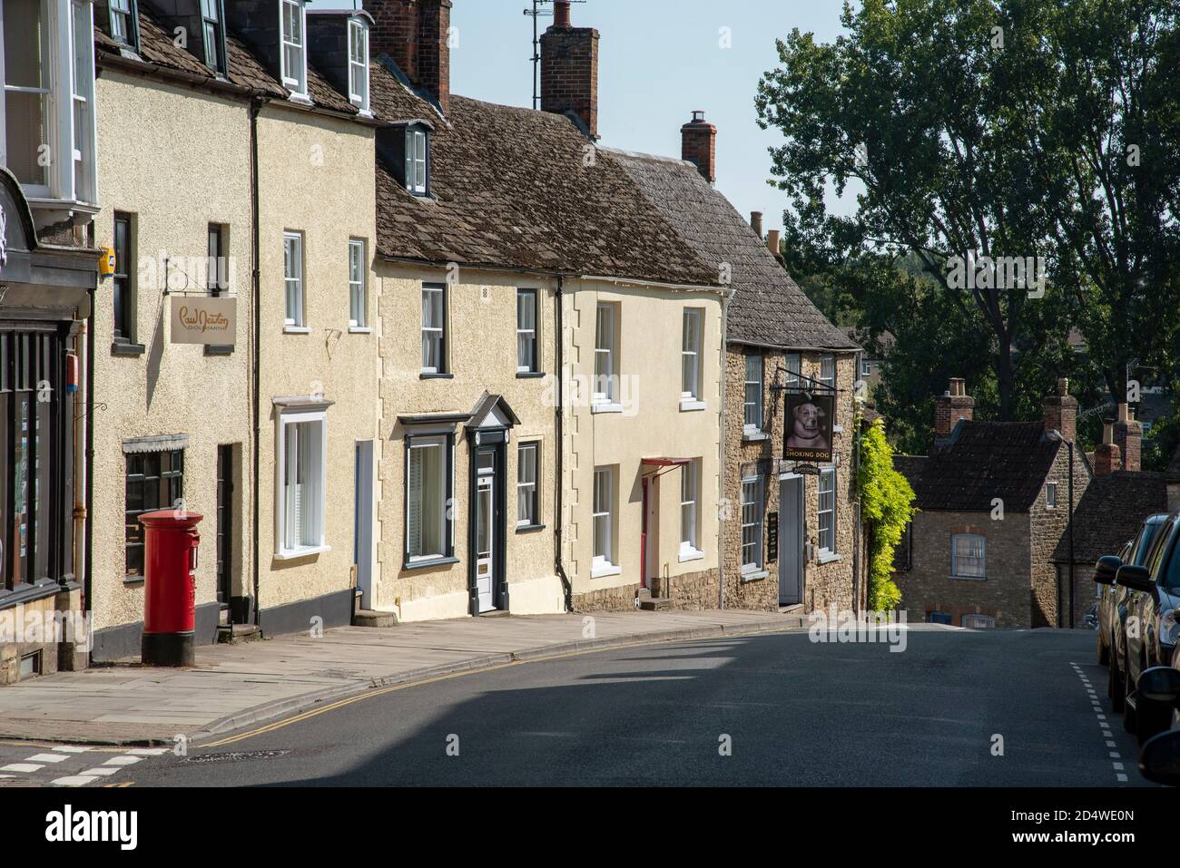 Malmesbury, Wiltshire, England, UK. 2020.  Businesses and homes on the High Street in Malmesbury, UK, Stock Photo
