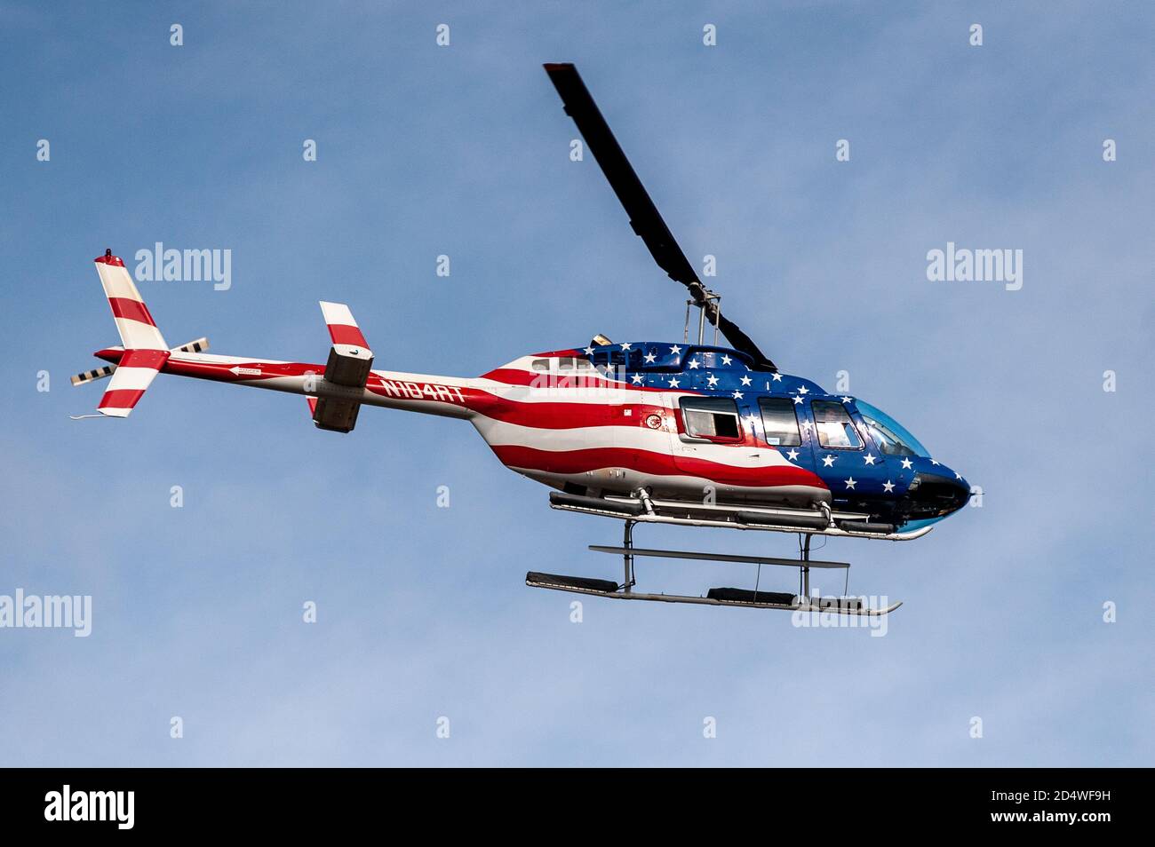 https://c8.alamy.com/comp/2D4WF9H/a-helicopter-painted-with-the-colors-of-the-american-flag-flies-over-the-trump-train-convoy-in-ronkonkoma-new-york-on-october-11-2020-photo-by-gabriele-holtermannsipa-usa-credit-sipa-usaalamy-live-news-2D4WF9H.jpg