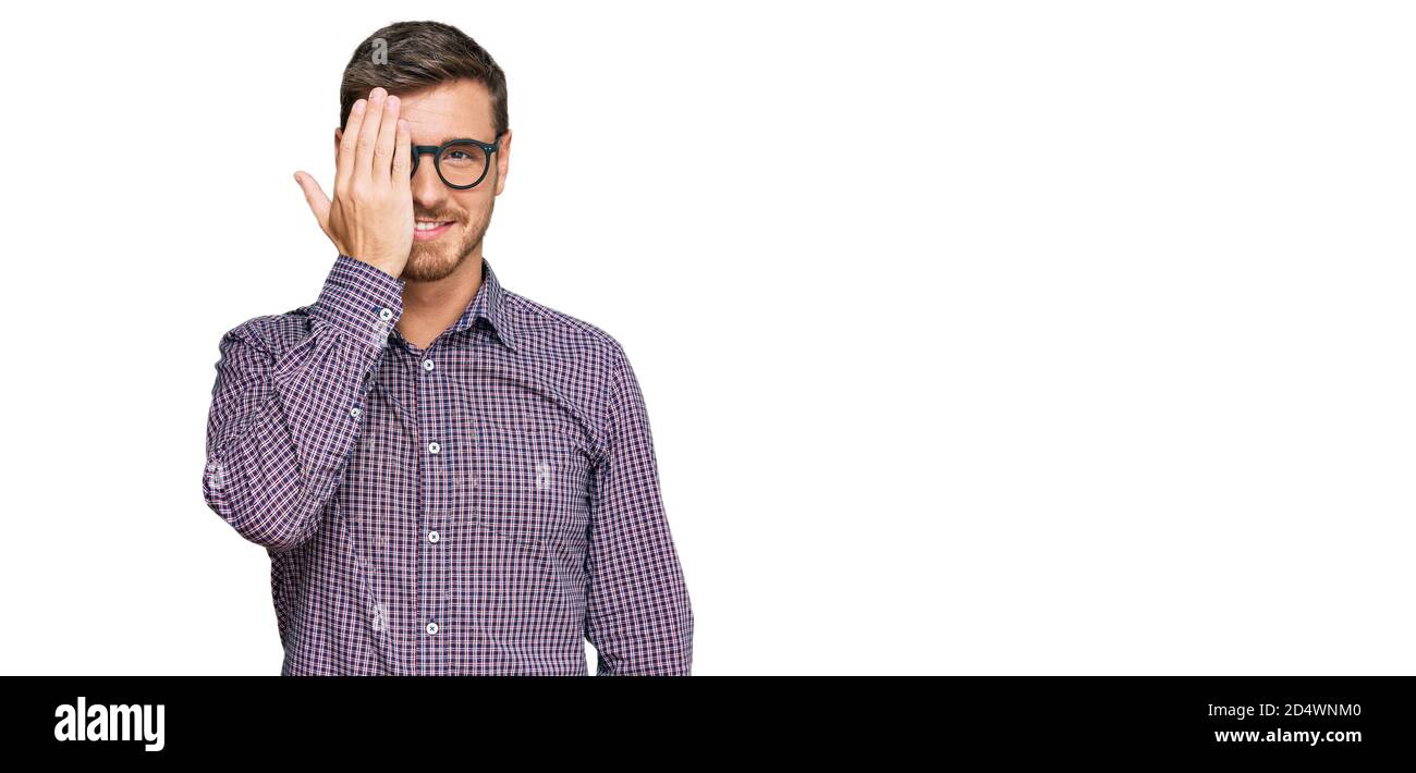 Handsome caucasian man wearing casual clothes and glasses covering one ...