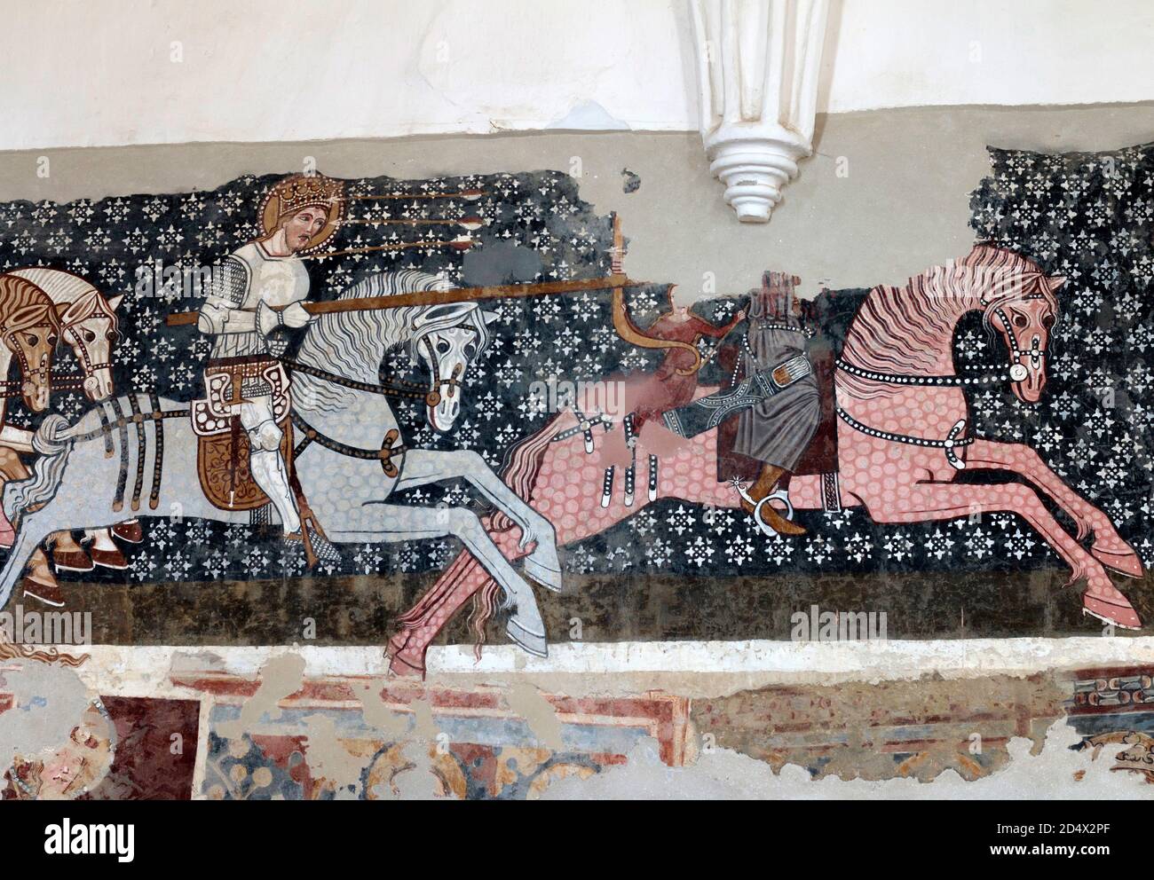 St Ladislas chases the cuman warrior with a spear. Three arrows fly to his head. Fresco detail in the Unitarian fortified church. Stock Photo