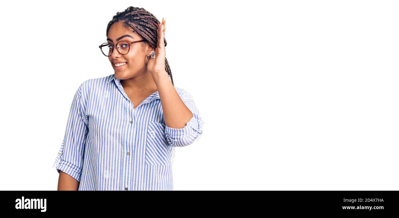 Young african american woman with braids wearing casual clothes and ...