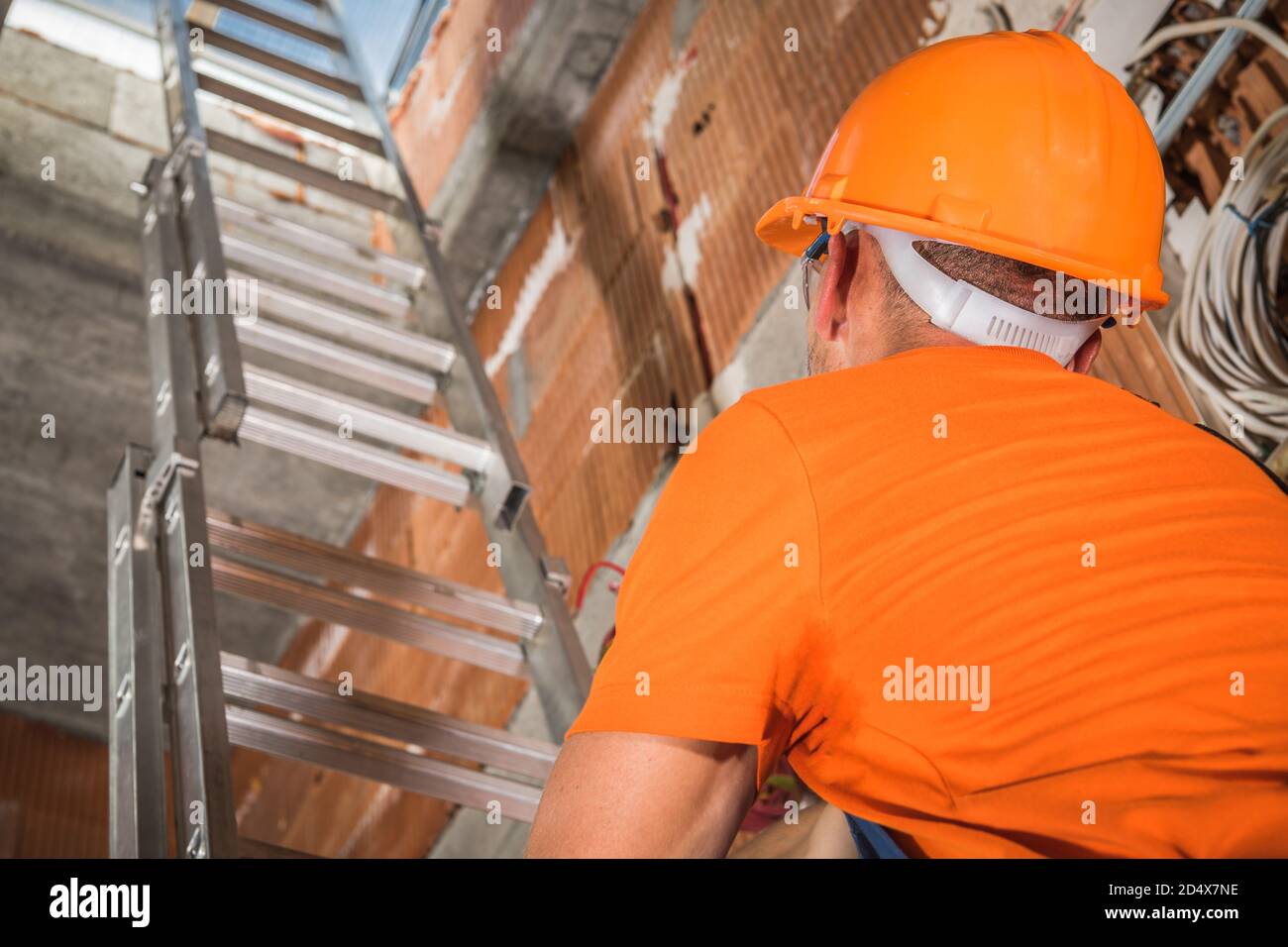 Worker wearing hard hat using hi-res stock photography and images - Alamy