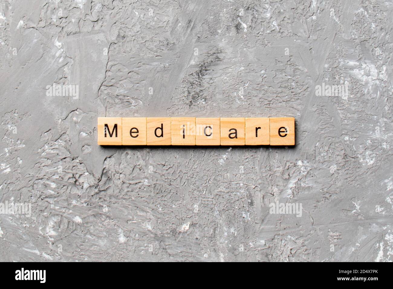 medicare word written on wood block. medicare text on table, concept. Stock Photo