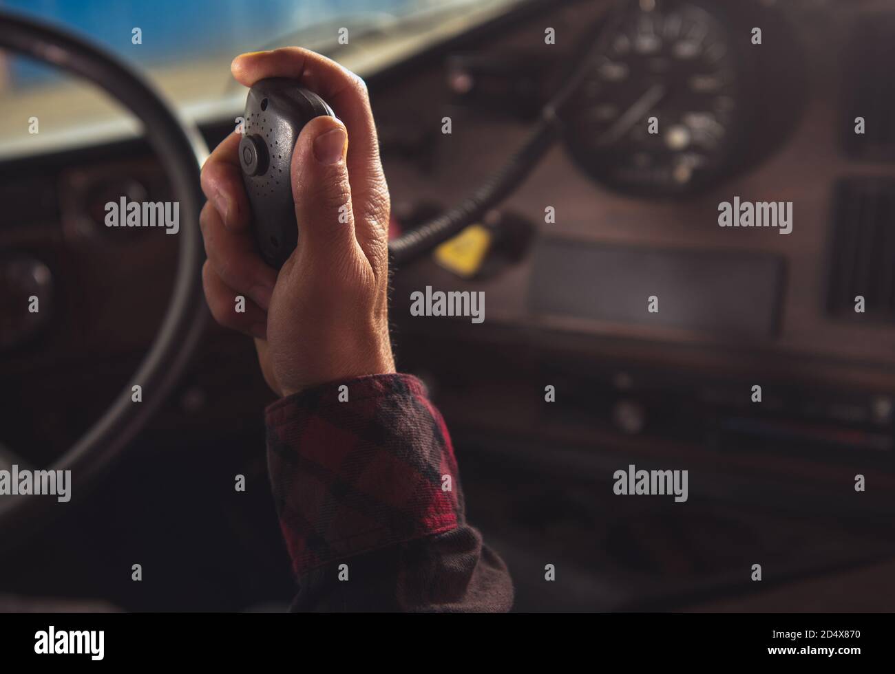 Caucasian Trucker Communicate with Other Truck Drivers in Convoy via CB