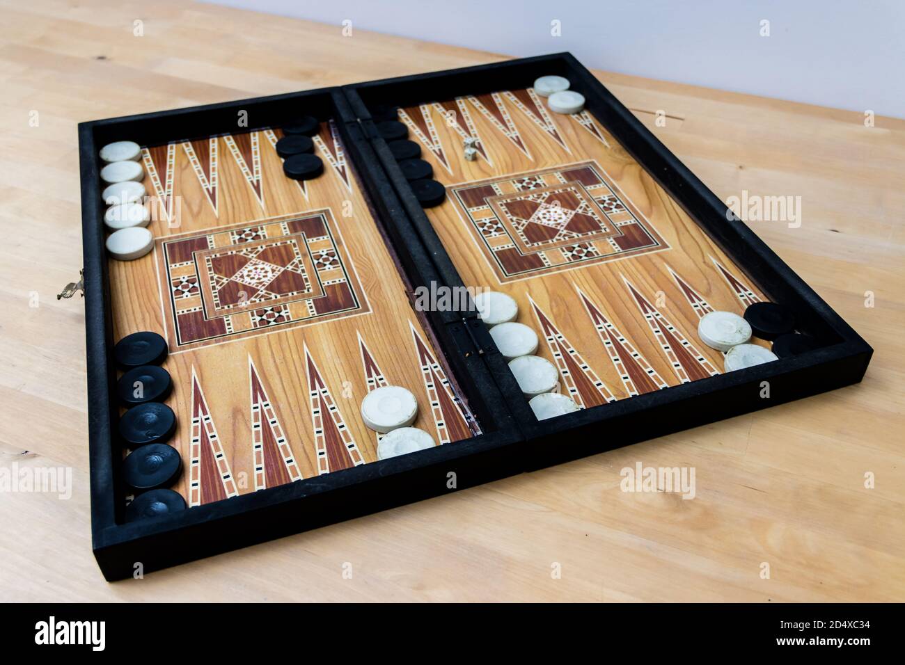 Backgammon set on wooden table Stock Photo