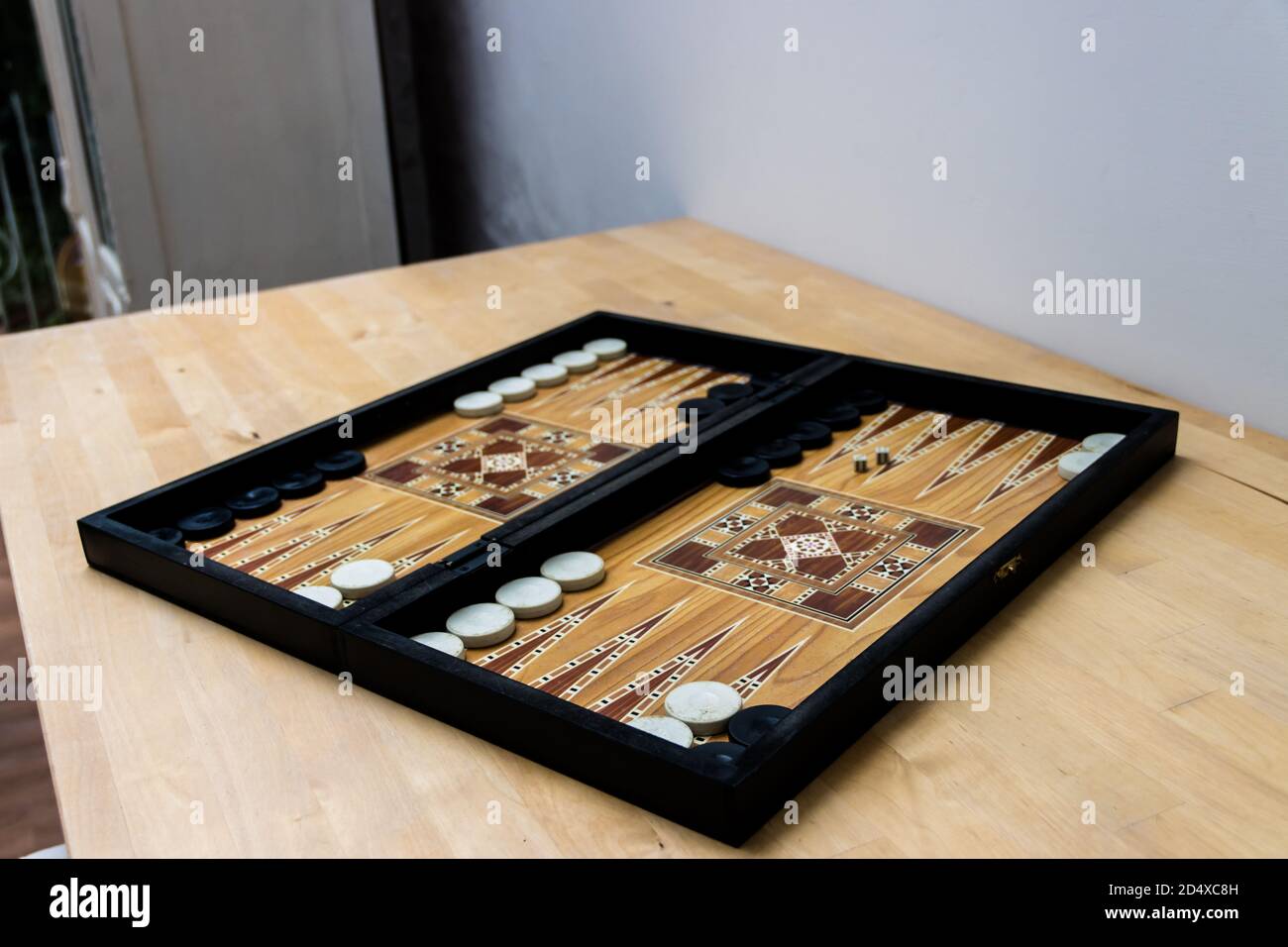 Backgammon board on the table Stock Photo