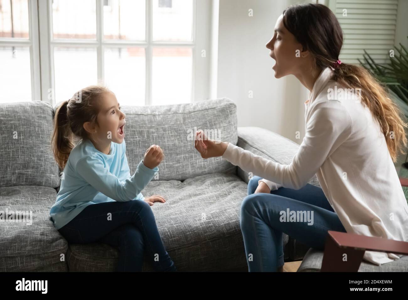 Little girl learn pronunciation with female teacher Stock Photo