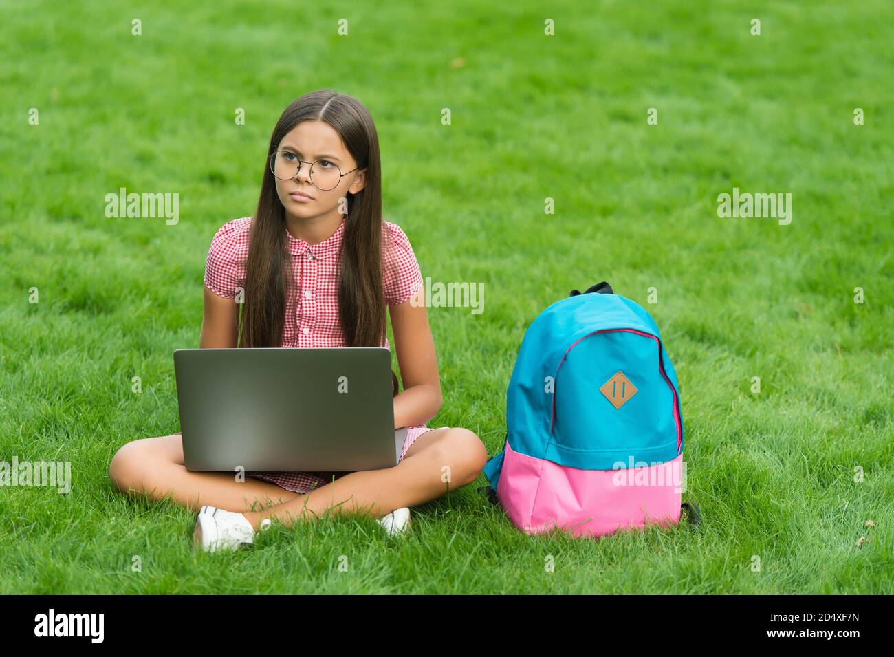 Serious school girl sit hi-res stock photography and images - Alamy