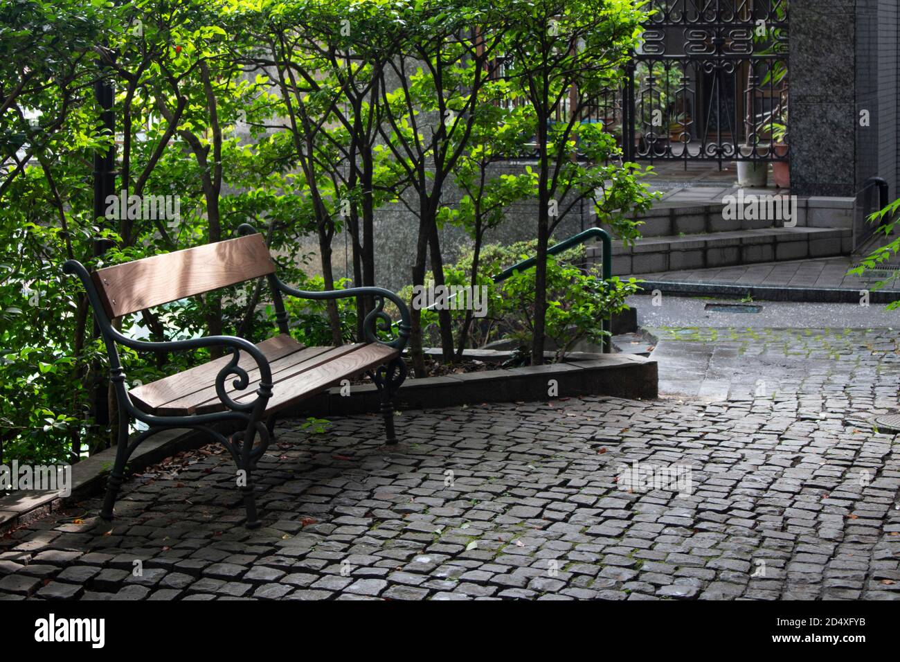 European style cobblestone courtyard with antique benches Stock Photo