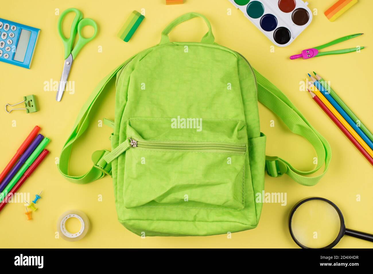 Back to school concept. Top above overhead view photo of green backpack ...