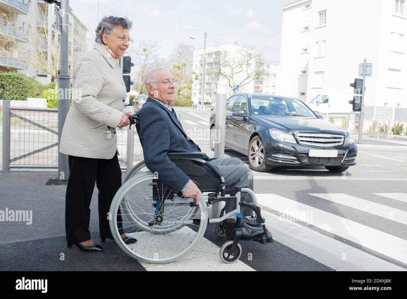 a handicapped crossing the street Stock Photo - Alamy