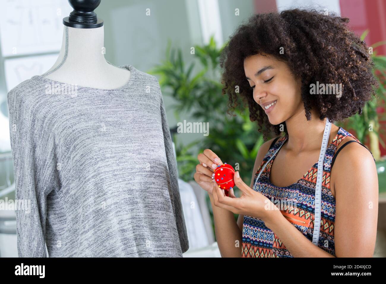 woman working on tailors dummy Stock Photo
