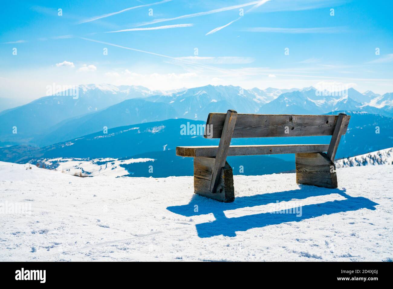 Wooden branch with a mesmerizing winter mountain view, a scenic place for solitude Stock Photo
