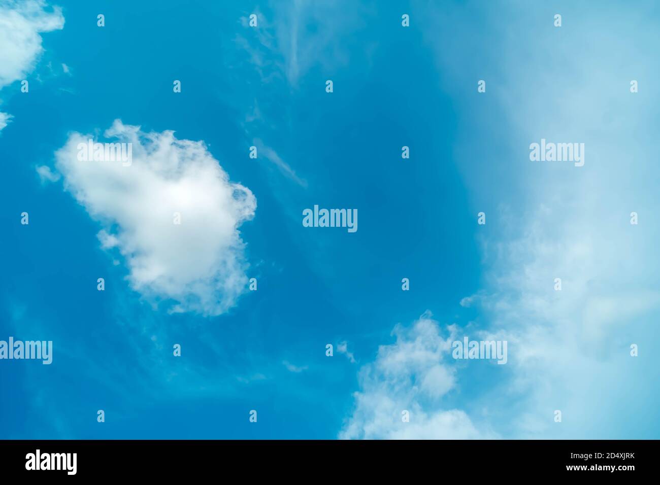 White fluffy clouds against blue sky in summer nature season weather ...