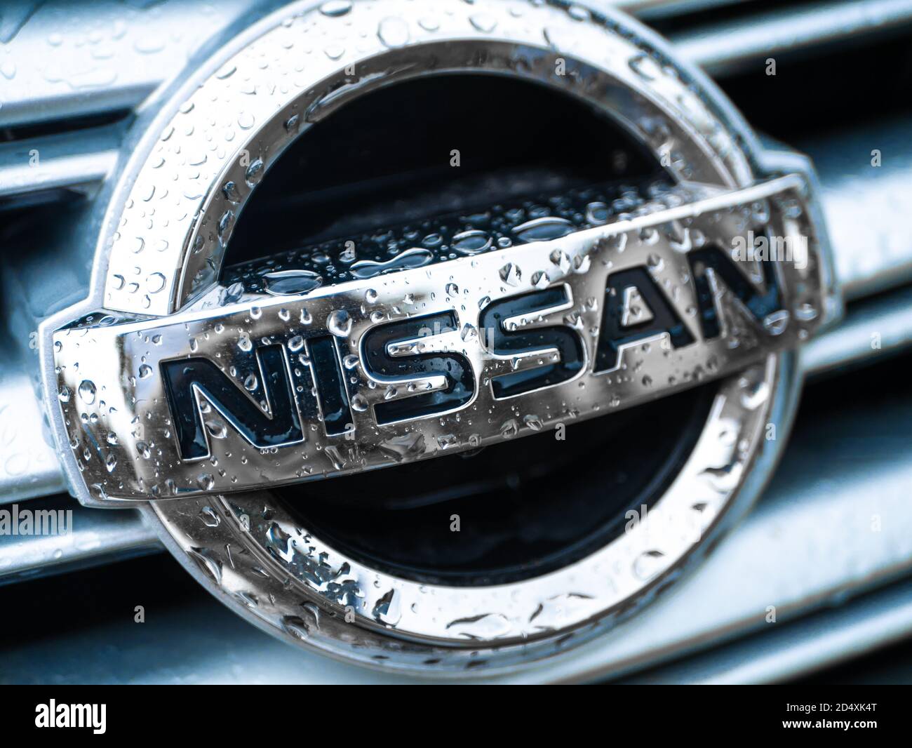 Nissan car nameplate emblem in water drops Stock Photo Alamy