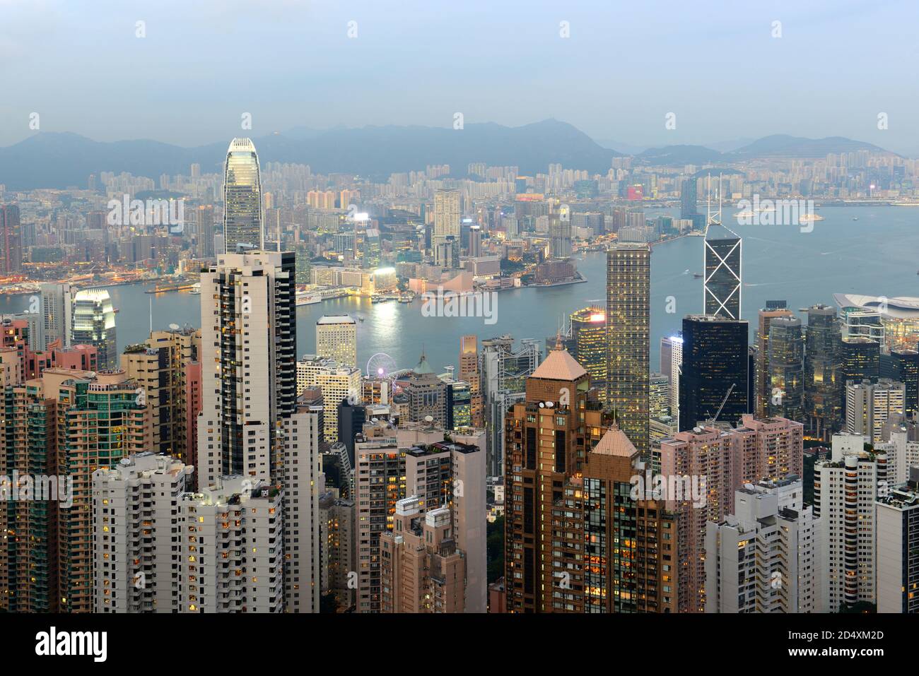 Hong Kong Skyline and Victoria Harbour at dusk from Victoria Peak on Hong Kong Island, Hong Kong, China. Stock Photo