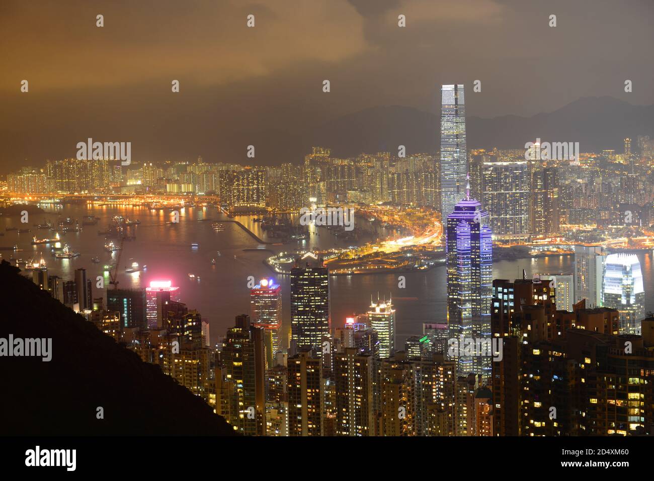 Hong Kong Skyline and Victoria Harbour at night from Victoria Peak on Hong Kong Island, Hong Kong, China. Stock Photo