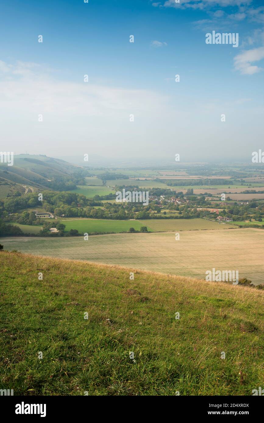 A misty autumnal equinox morning view of the Fulking Escarpment and Fulking village, West Sussex, UK Stock Photo