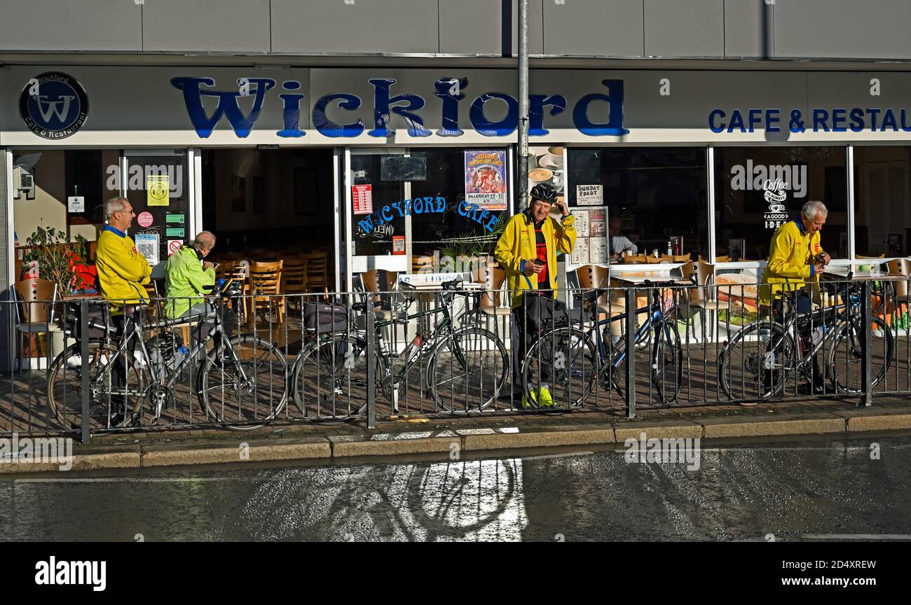 Cyclists outside the Wickford Cafe and Restaurant in the Broadway, Wickford, Essex. Stock Photo