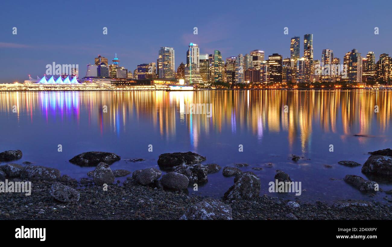 Night skyline with reflection of Vancouver Downtown as seen from Stanley Park, British Columbia, Canada Stock Photo