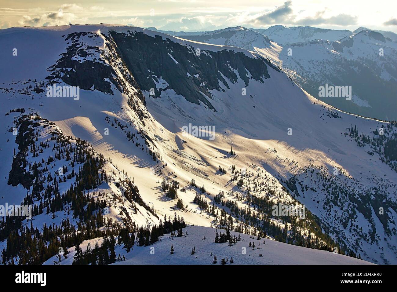 Mountain landscape panorama with snow slope and spruce trees during sunset, Needle Peak, Coquihalla, British Columbia, Canada Stock Photo