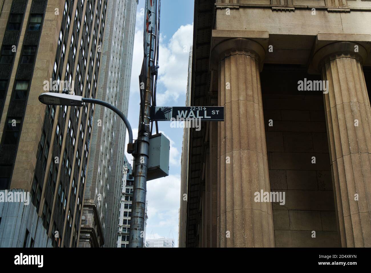 Road sign of New York Wall street corner Broad street Stock Photo