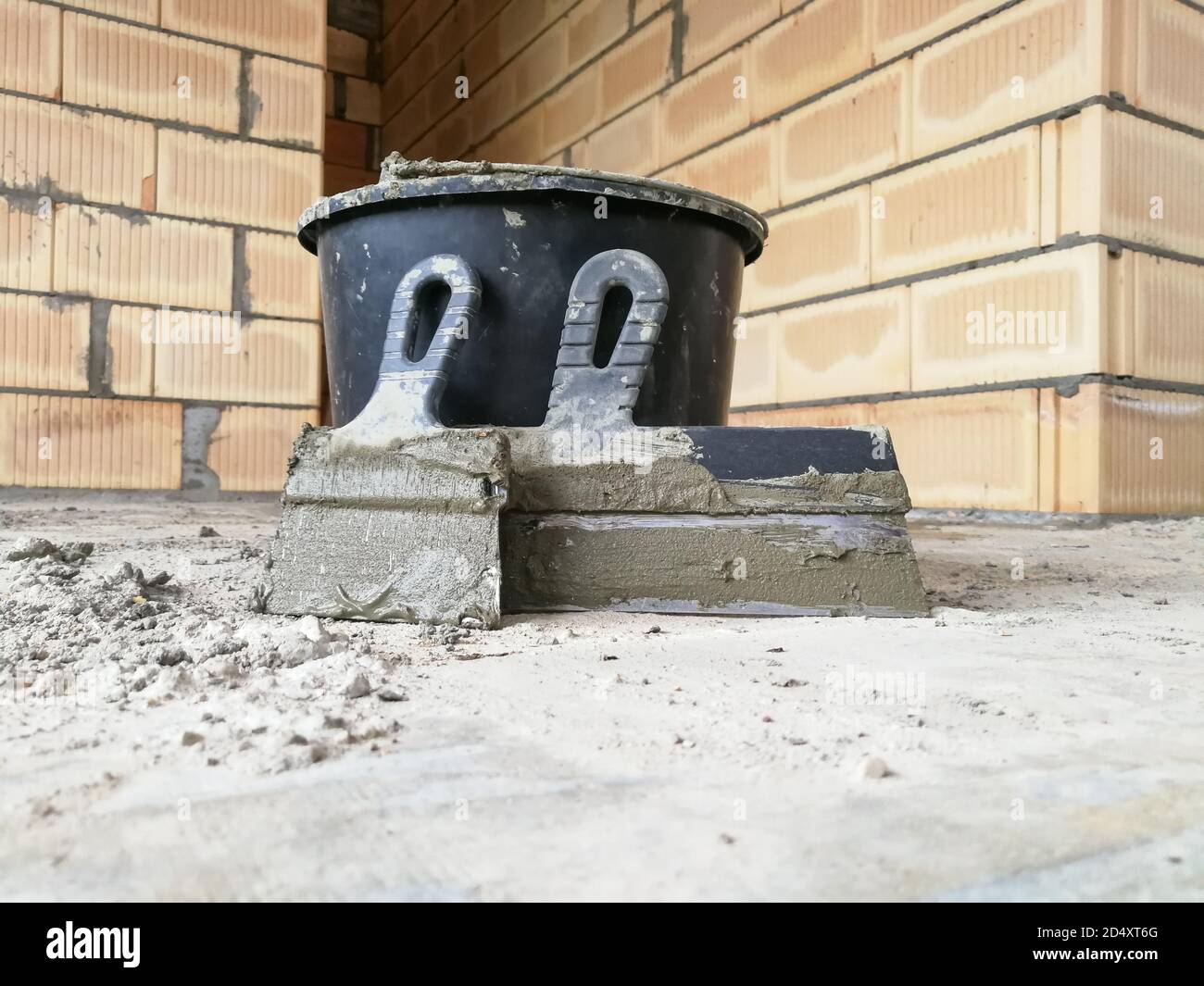 Taping knifes and cement bucket(construction work tools) for