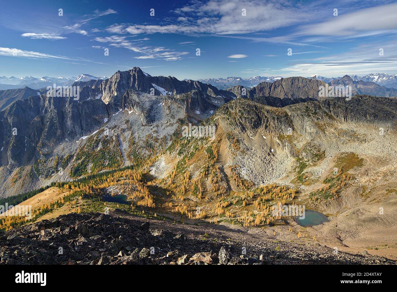 Panoramic view of mountain valley with two glacial lakes, yellow golden larches, Mount Frosty,  Manning Provincial Park, British Columbia, Canada Stock Photo