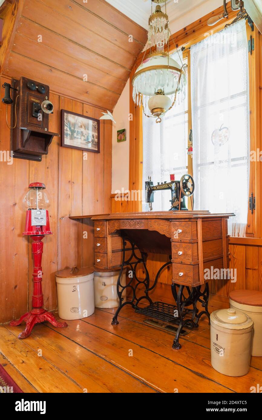 Antique Brunswick sewing machine in corner of dining room inside an old